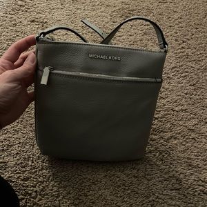 New with Tags Michael Kors grey crossbody bag. 9”x 9” with silver hardware.